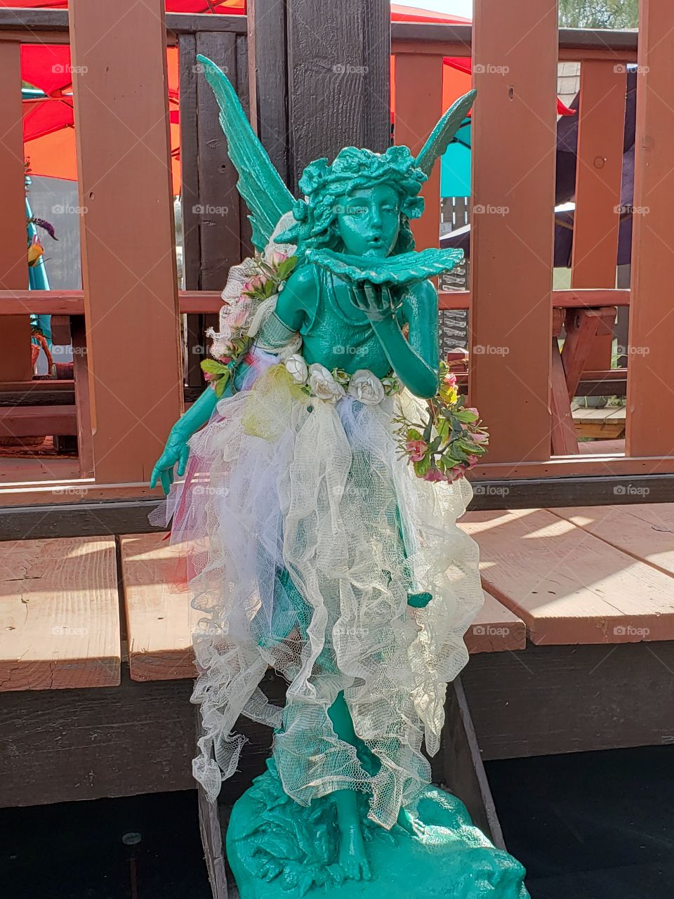 A lovely depiction of a faerie, with touches of color and flora, one of my favorite decorations at the Renessaince Fair this year.