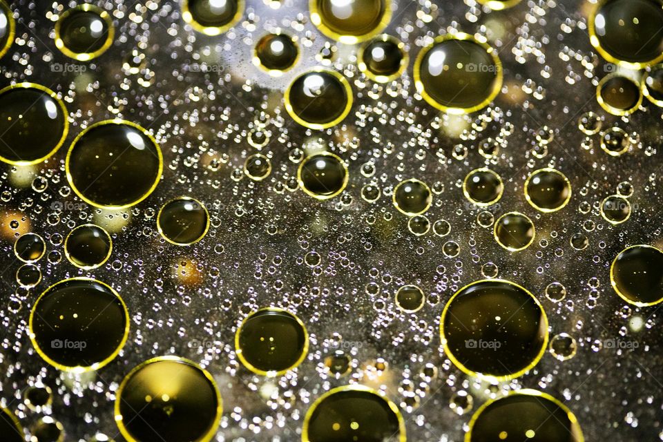 Golden oil Bubbles Close Up background amazing colours droplets of life in black texture macro look summer mood positive vibes wonderful day hustling daydreaming