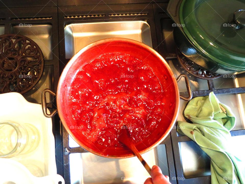 making delicious organic strawberry jam at my friend's