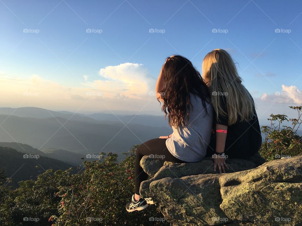 Friends climbing mountains together 
