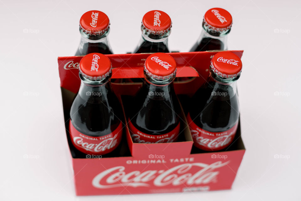 Coke bottles on white background 