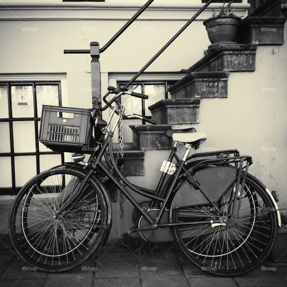 Two bicycles parked in the street in Amsterdam, the Netherlands 