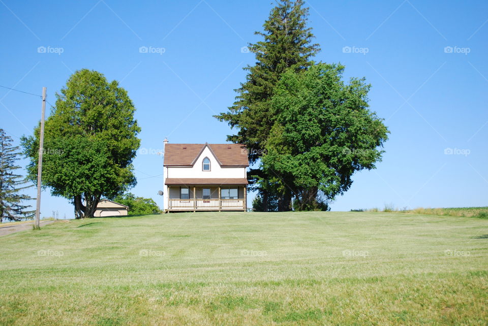 Country House on a hill with big blue sky