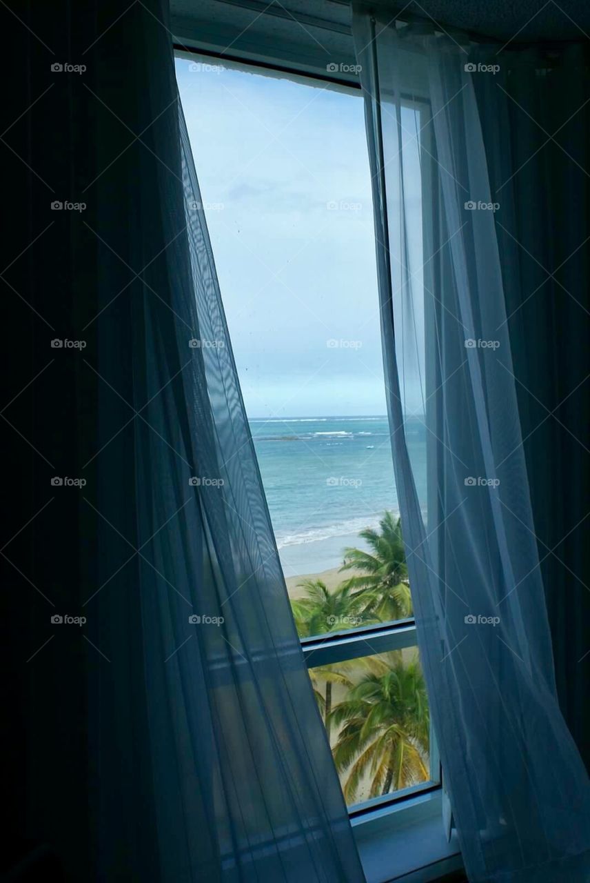 White sand beach through window