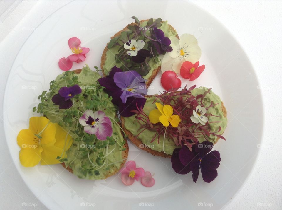 Avocado Toast with microgreens and edible flowers.