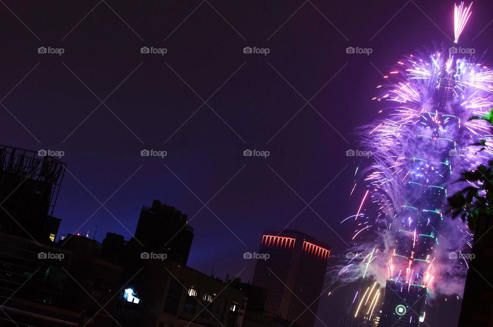 Fireworks shoot off from Taipei 101. 