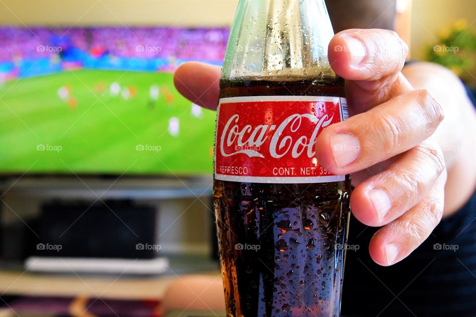 Enjoying football with Coke