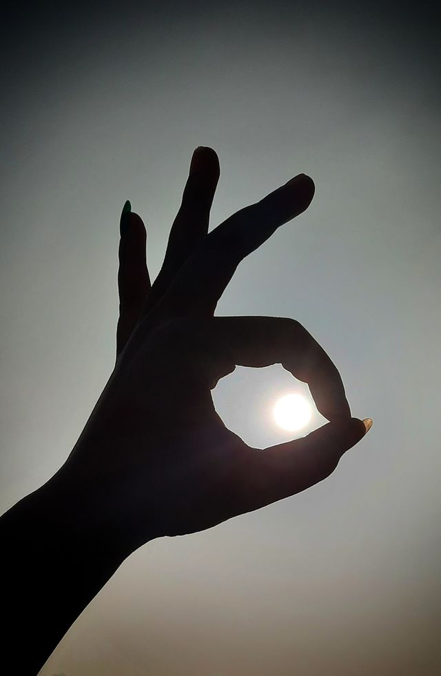 In this photo I captured hand and sun. I captured a black and white photo by reflection of sun , without filter, reflection of sun