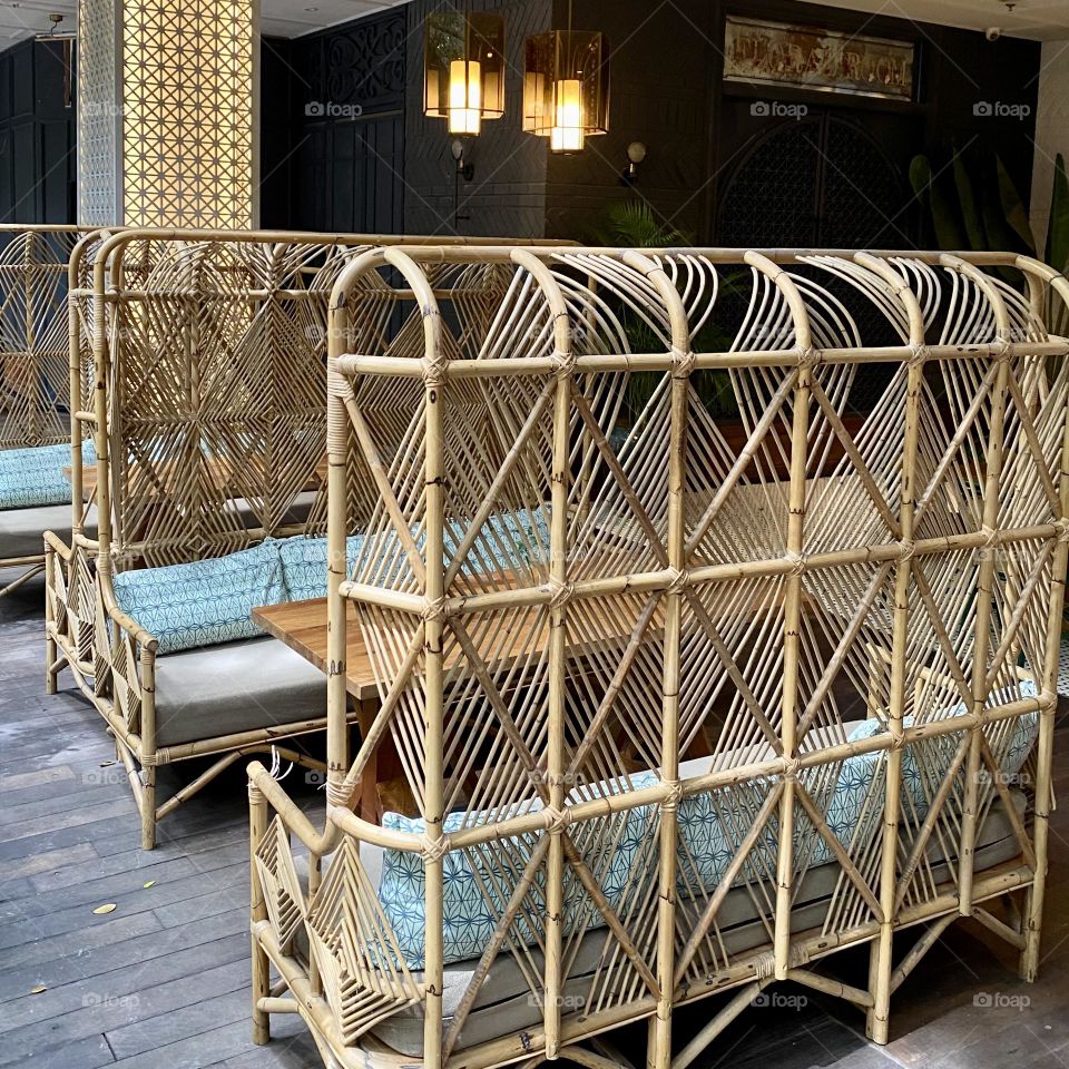 Cafe with greenery, wooden accents and warm lighting 