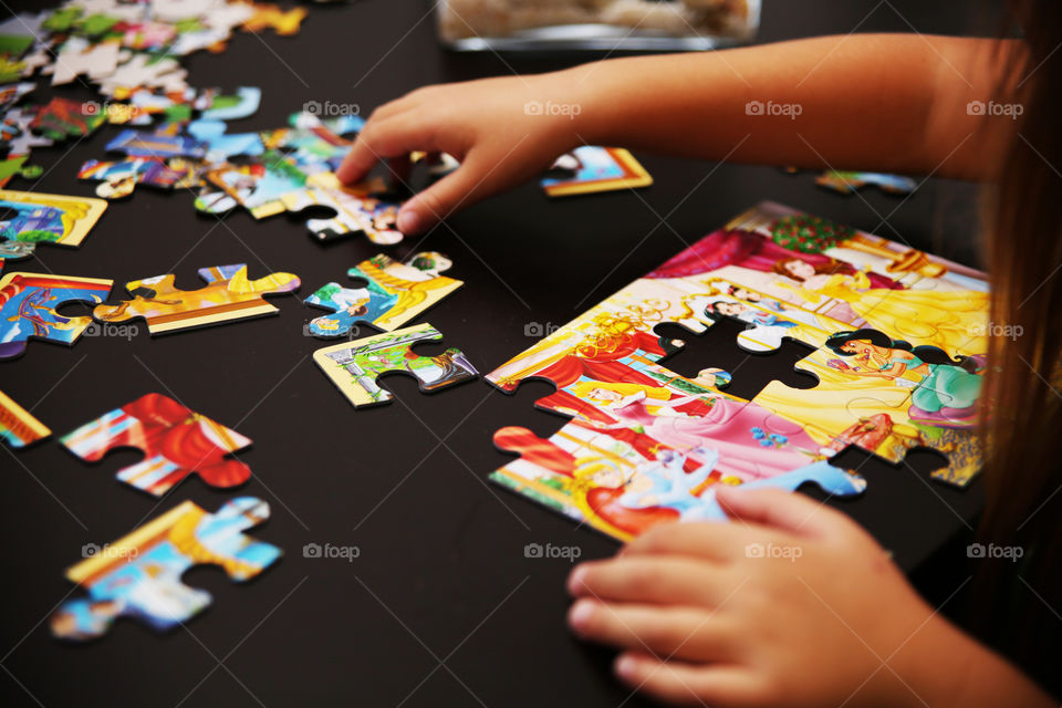 Girl playing with puzzles