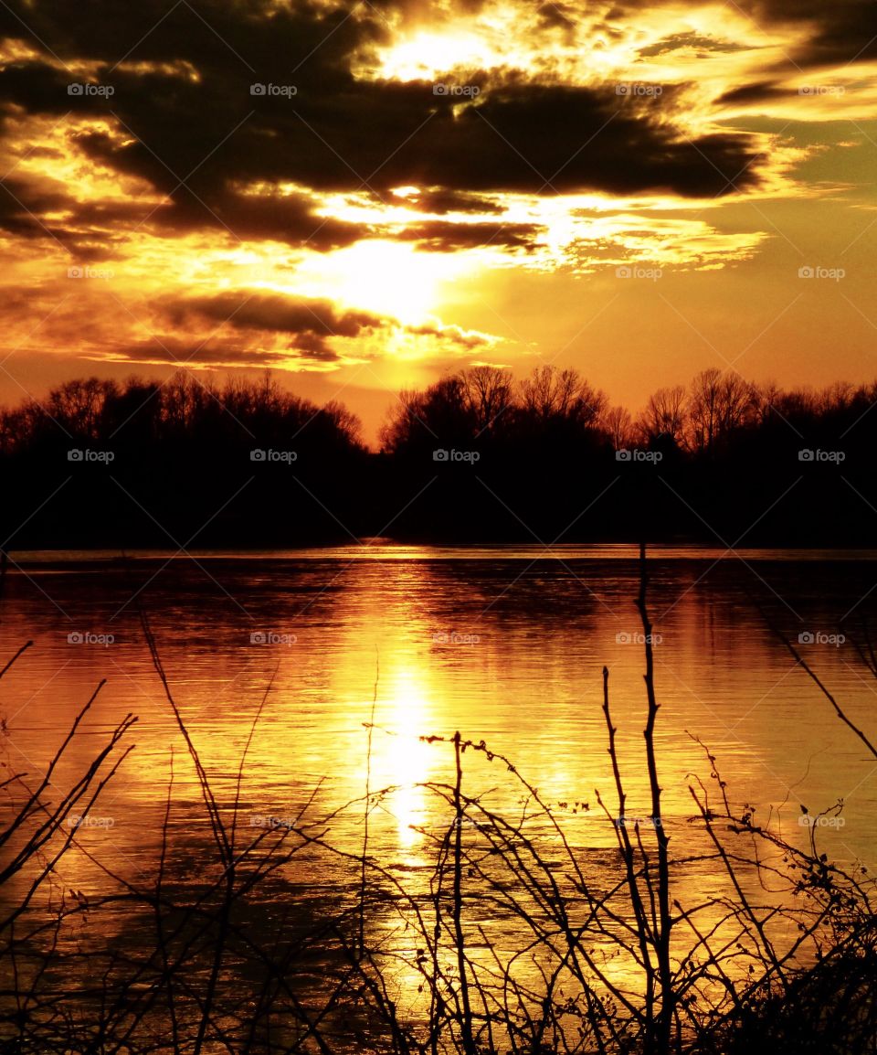 Beautiful view with a cross of sunlight on the lake. 