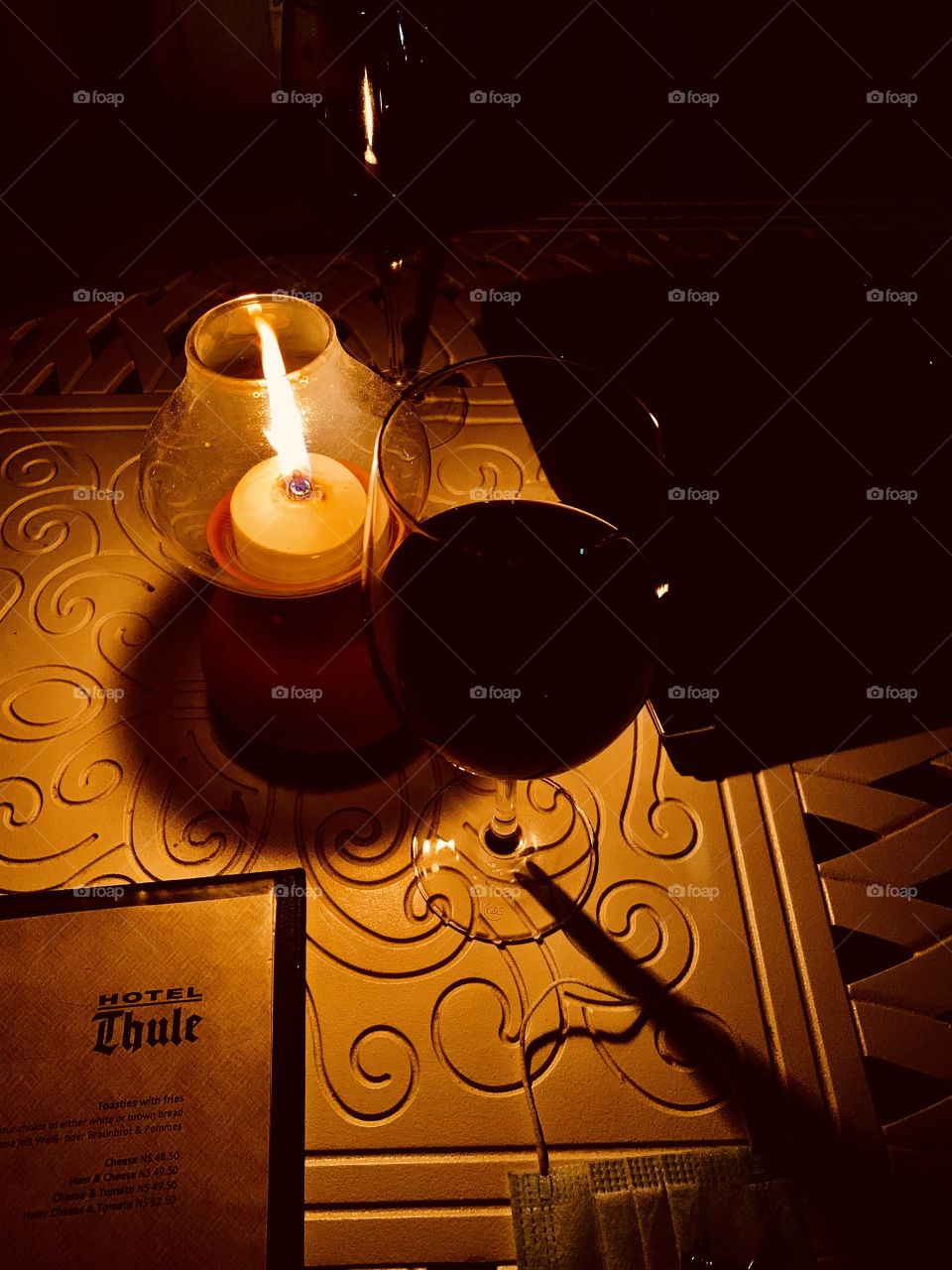 A paraffin lamp at a dinner table at a hotel. Perfect spot for couples.