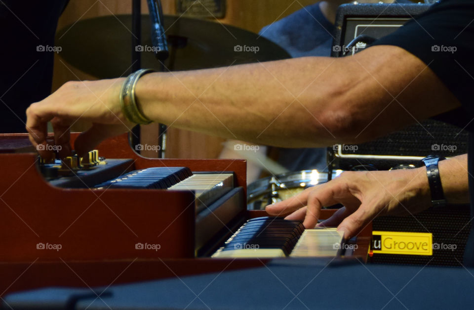Hands playing keyboard