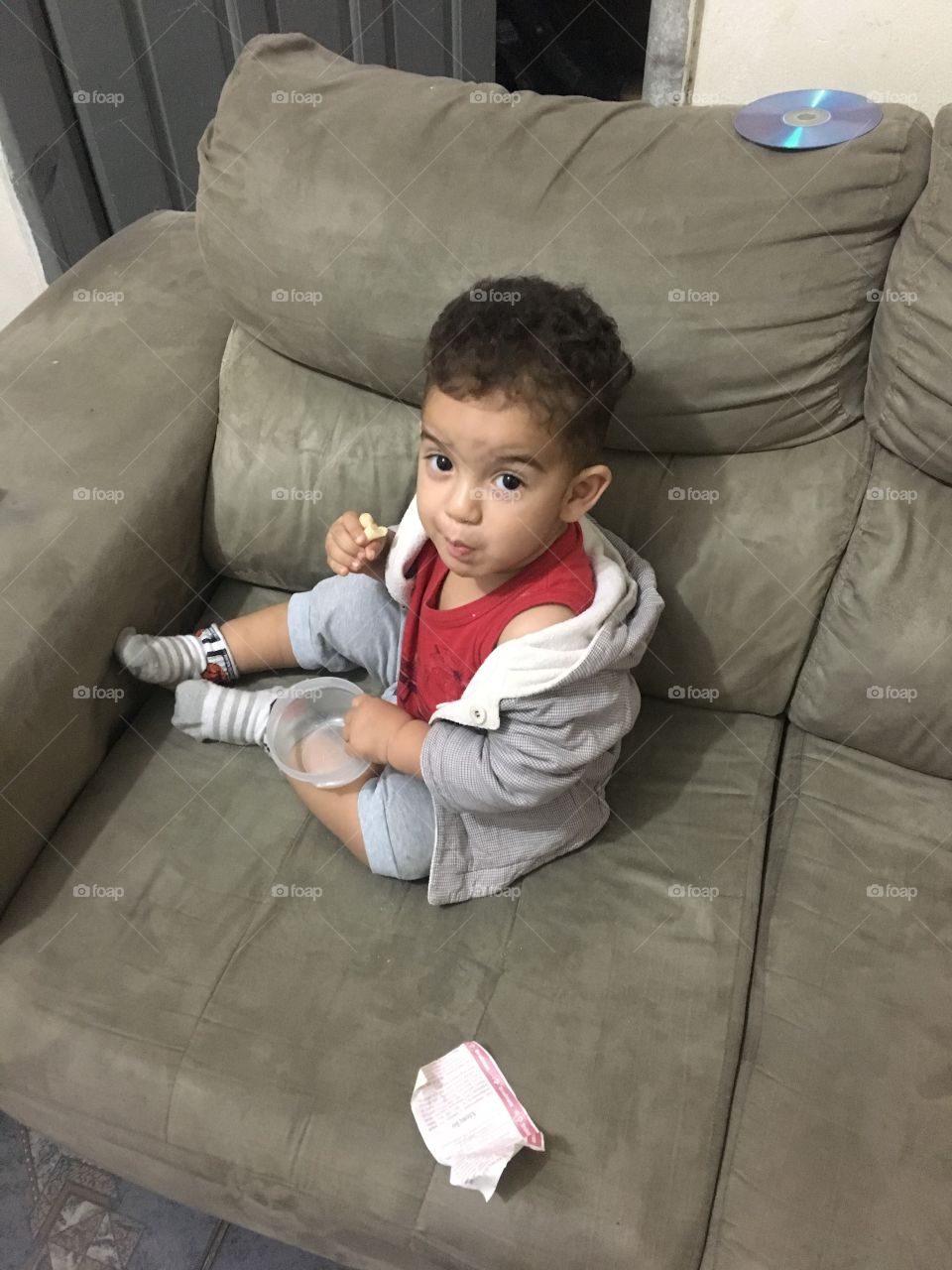 Baby eating chips at house