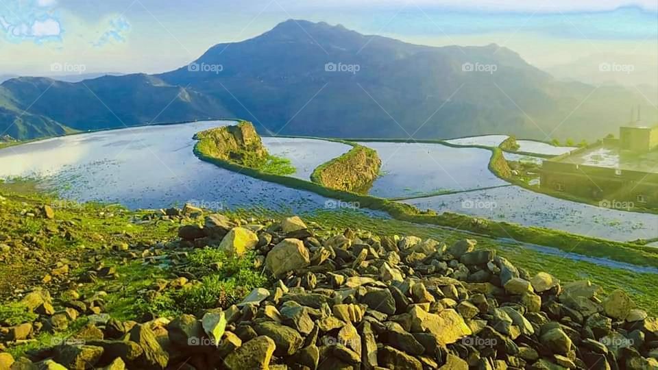 Glory be to God, the magnificent and picturesque view and the natural green trees are a view that is nothing more wonderful than it