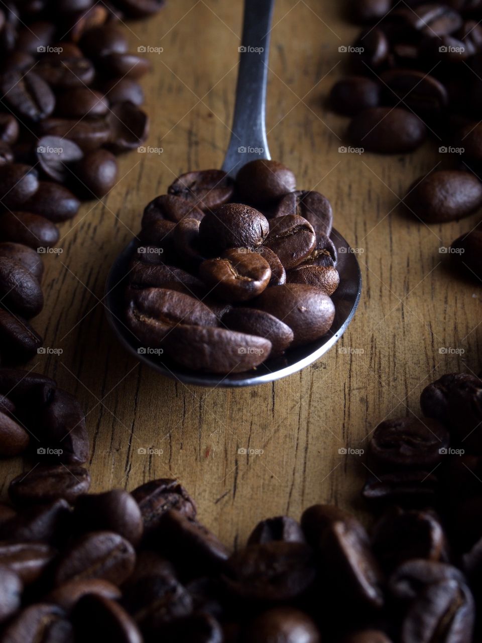 coffee beans on a spoon. coffee beans on a spoon