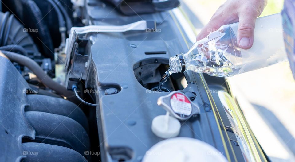 Filling radiator in car