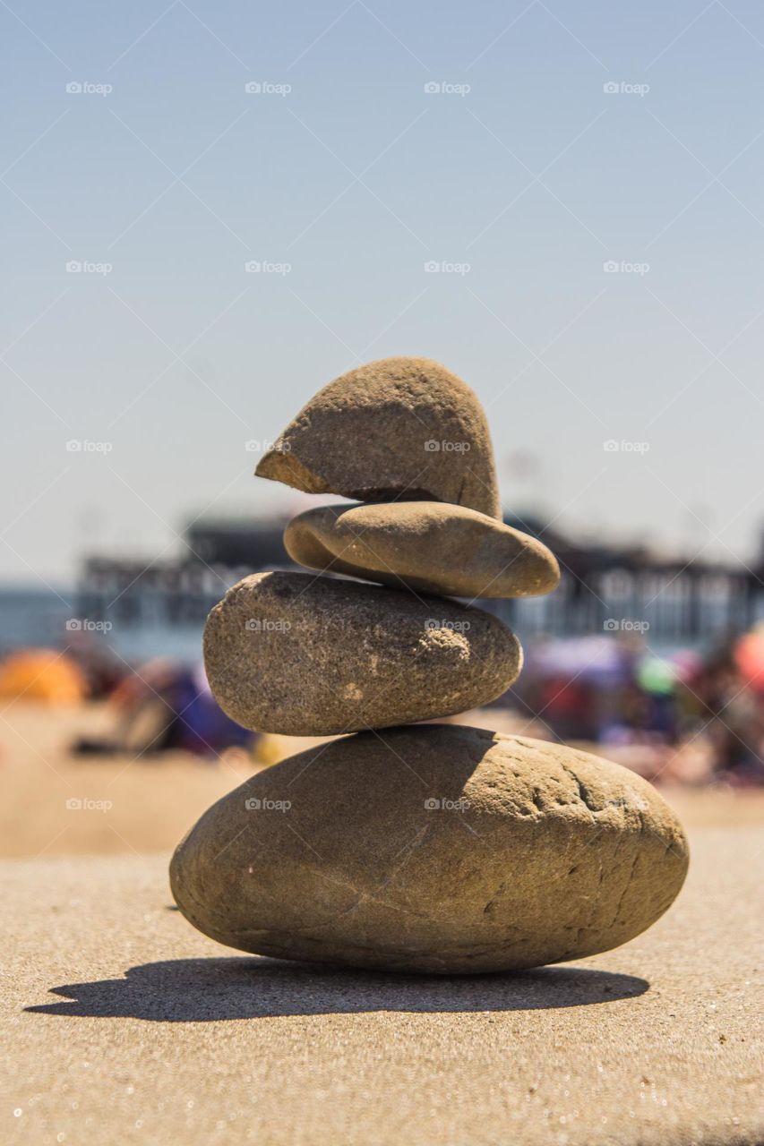 Stacked rocks on a wall in the beach town of Capitola by the Sea in California on a warm summer afternoon 