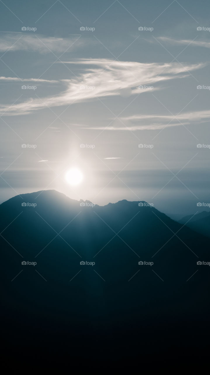 An inspiring mountain landscape. Tatry mountains in Slovakia. A beautiful wallpaper for smartphone screen. Monochrome blue abstract gradient with perspective.