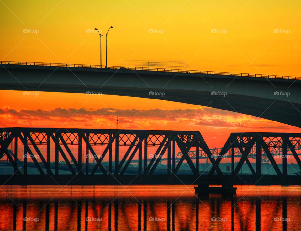 Bridge over lake during sunset