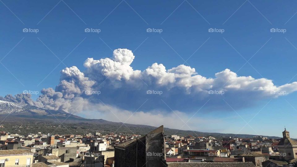 Etna volcano erupting and spewing ash, view from Adrano, Catania