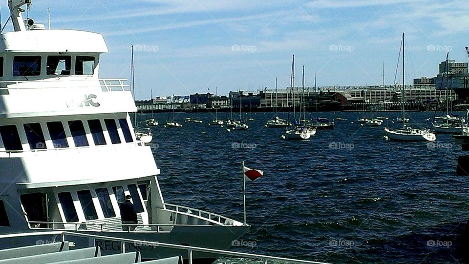 Boston Harbor. Sailboats moored in the harbor and the ferry