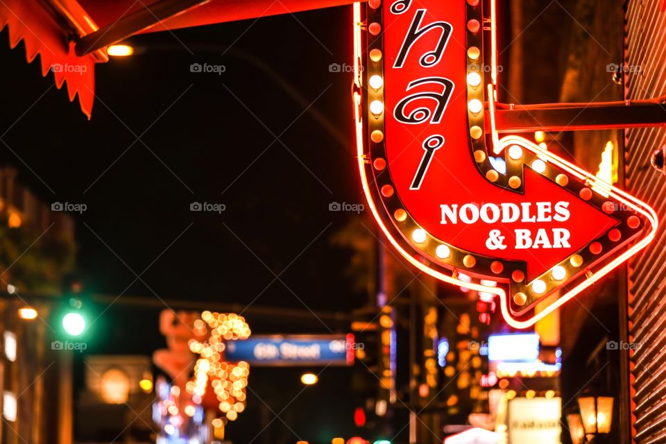Entrance to a Thai restaurant in Downtown Las Vegas. City lights in bokeh in the background.