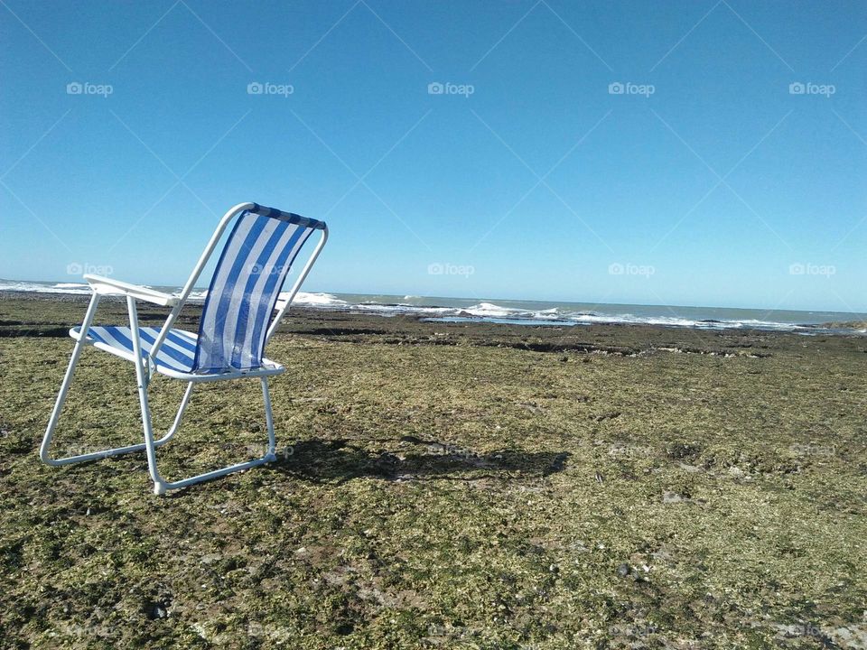 Beautiful blue chair near the beach at essaouira in Morocco.