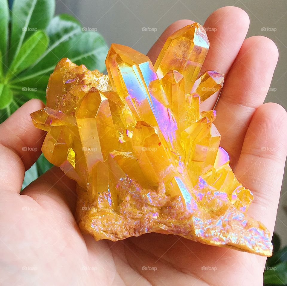 An orange angel aura crystal cluster.