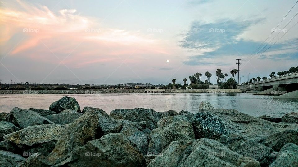 moon over Santa Ana river. moon coming out over the Santa Ana river mouth