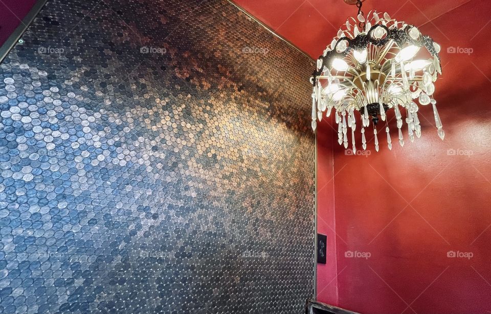 Entrance to a bar with a wall made of pennies. 