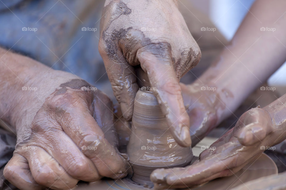 Close-up of hand doing pottery