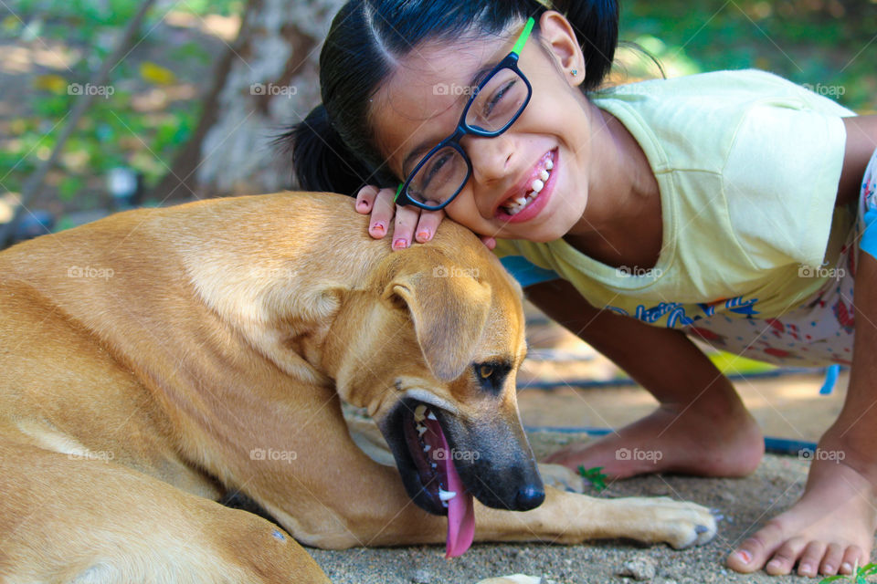 Indian girl loving her dog