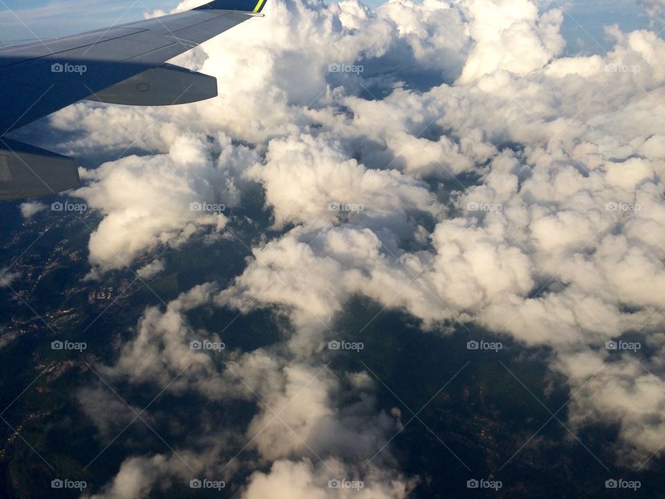 View of airplane wing and clouds
