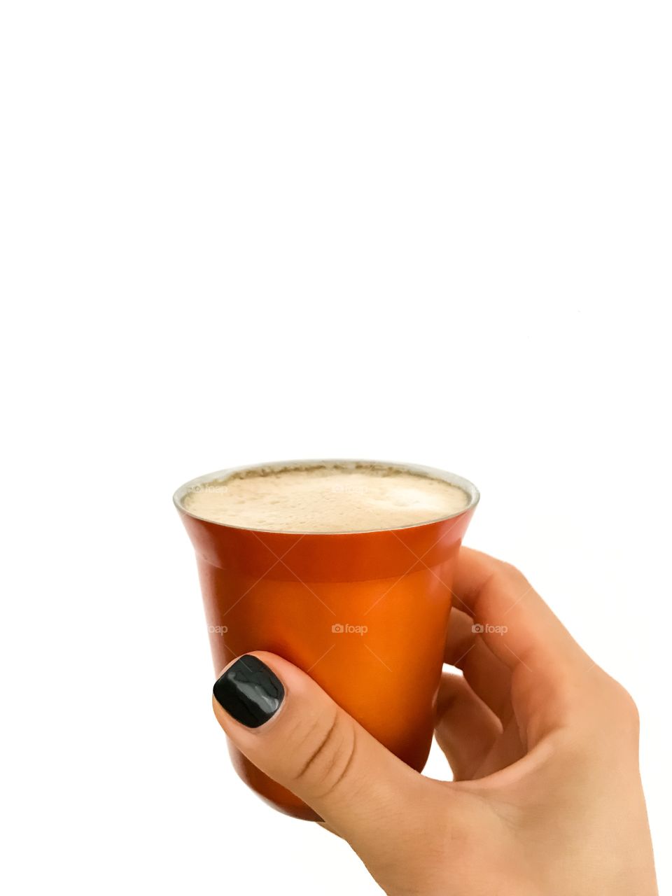 Nespresso moments: a hand holding a cup of morning coffee 