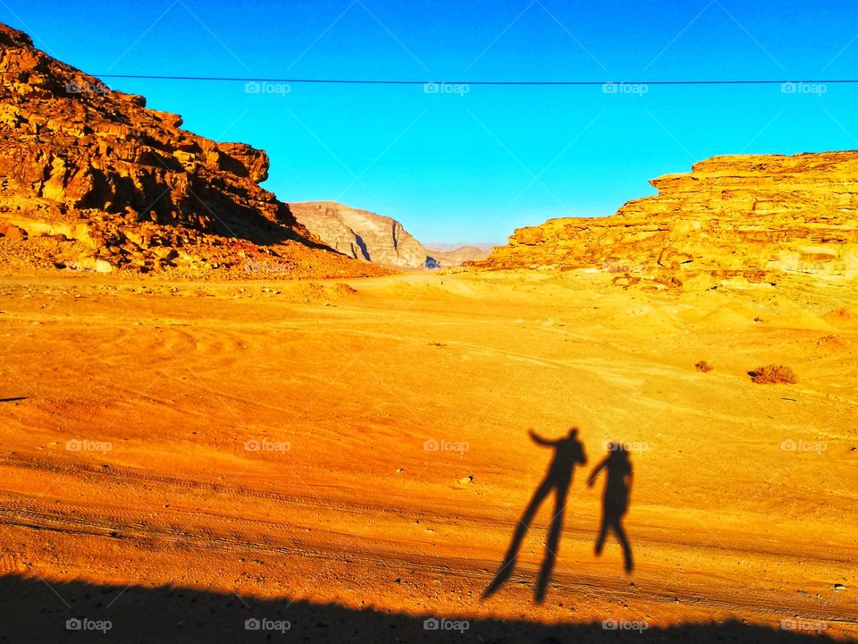 shadows leap in Jordan's hot Wadi Rum desert