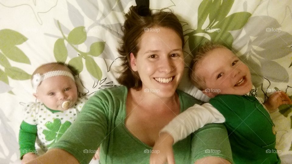 St.Patrick Day. Took a group selfie while me and the kids were playing on the bed on st.patricks day.