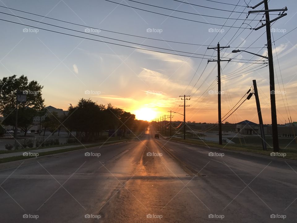 Sunset at the end of a road