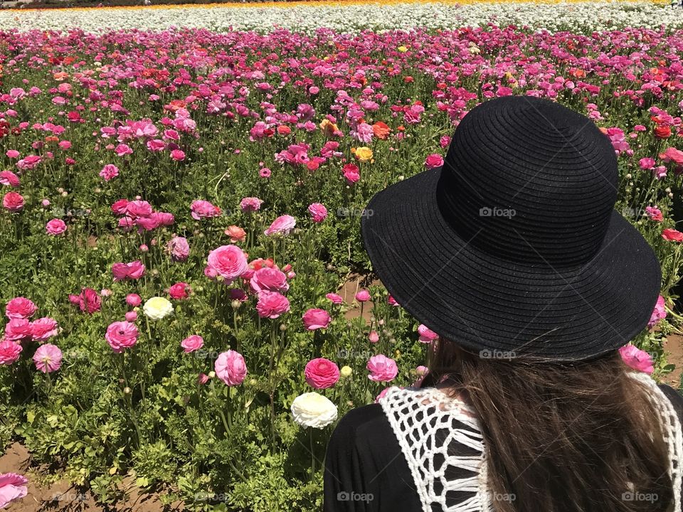 A girl In a field of flowers