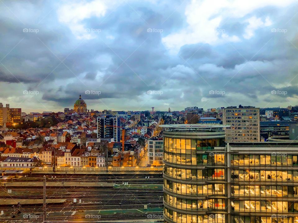 Brussels city on a cloudy morning showing the lights of the offices and the houses of the old part of the city