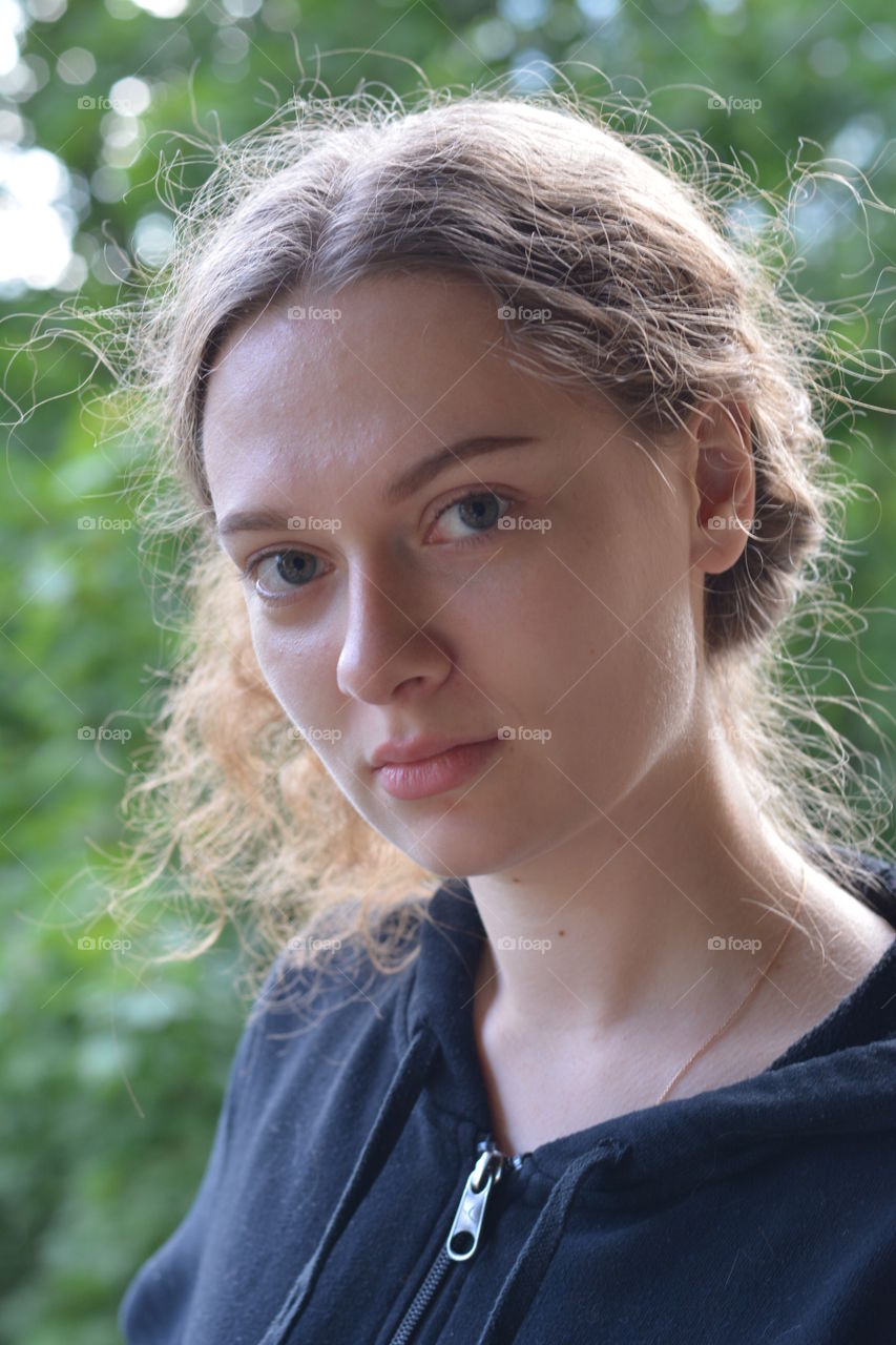 brunette girl beautiful portrait outdoor green background