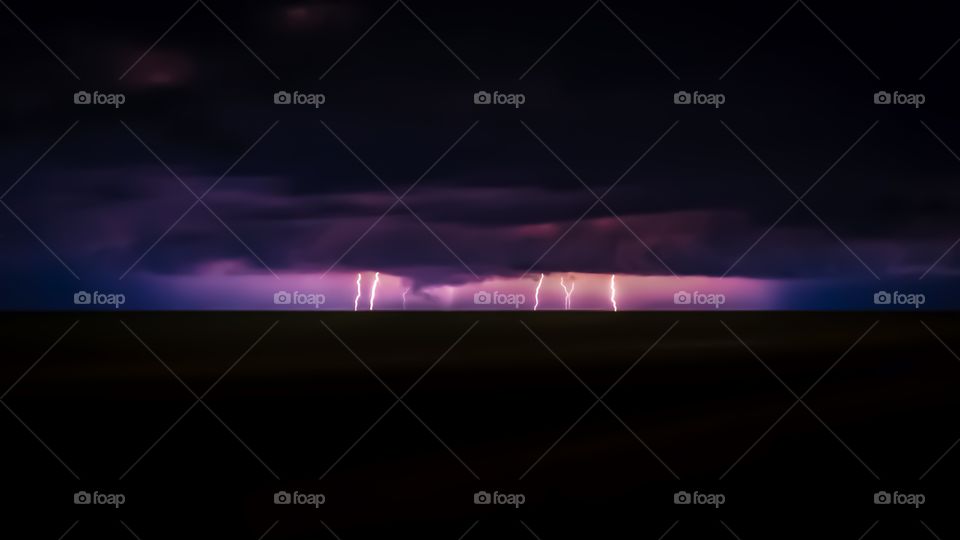 Thunderstorm over silhouette land