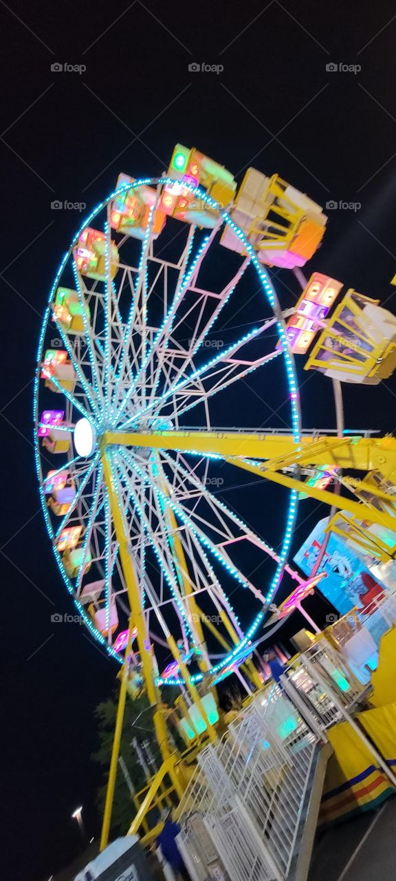 Cute ferris wheel at a shopping mall carnival in Newington New Hampshire 6/22