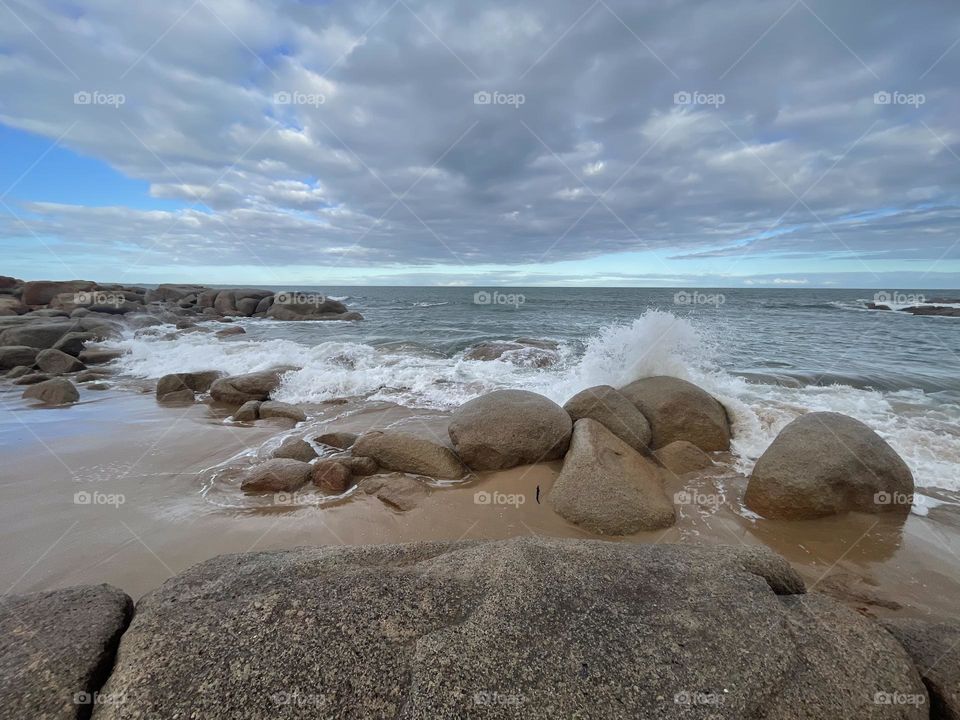 Water splashing over rocks 