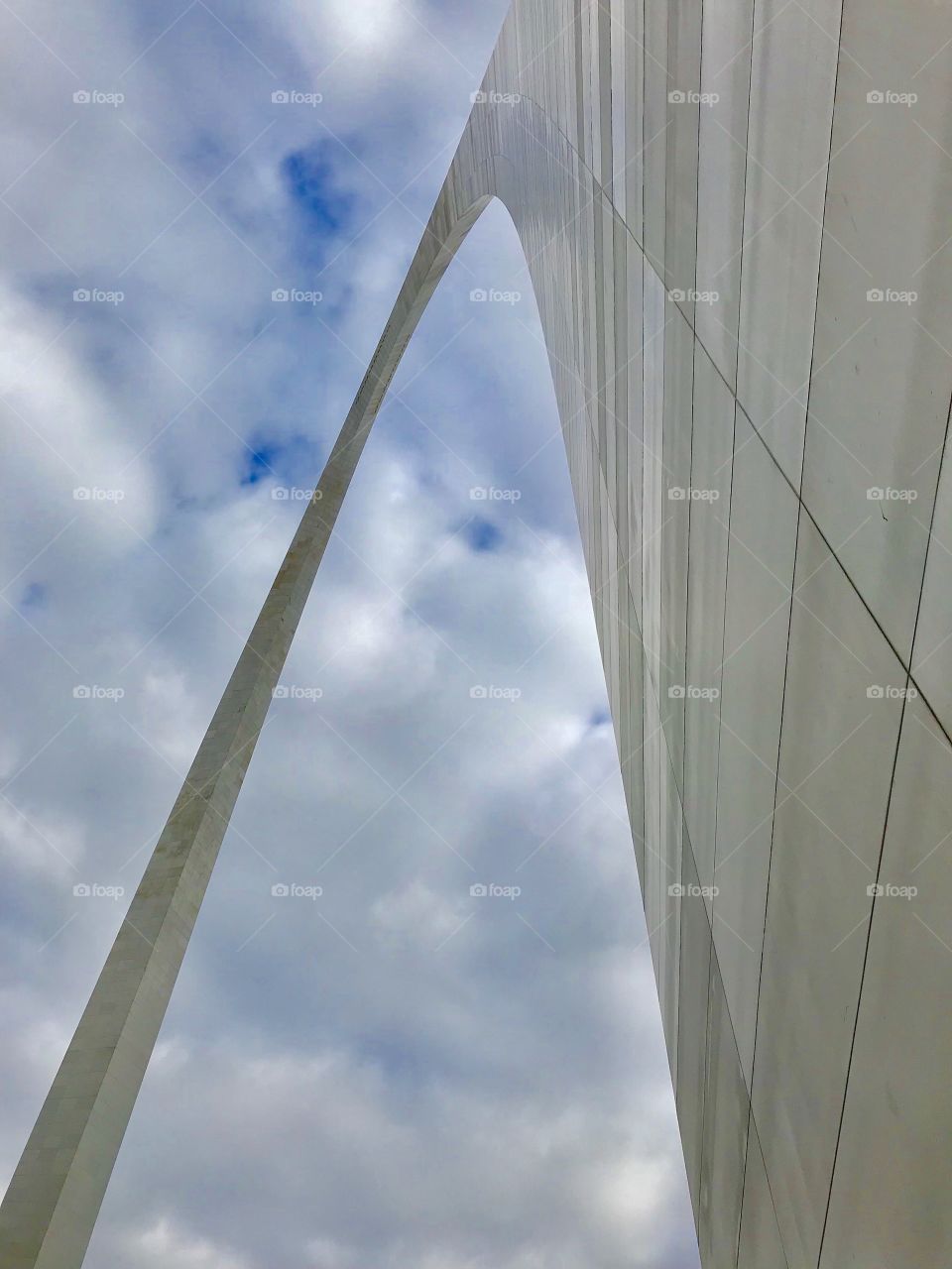 St. Louis arch cutting through the clouds 