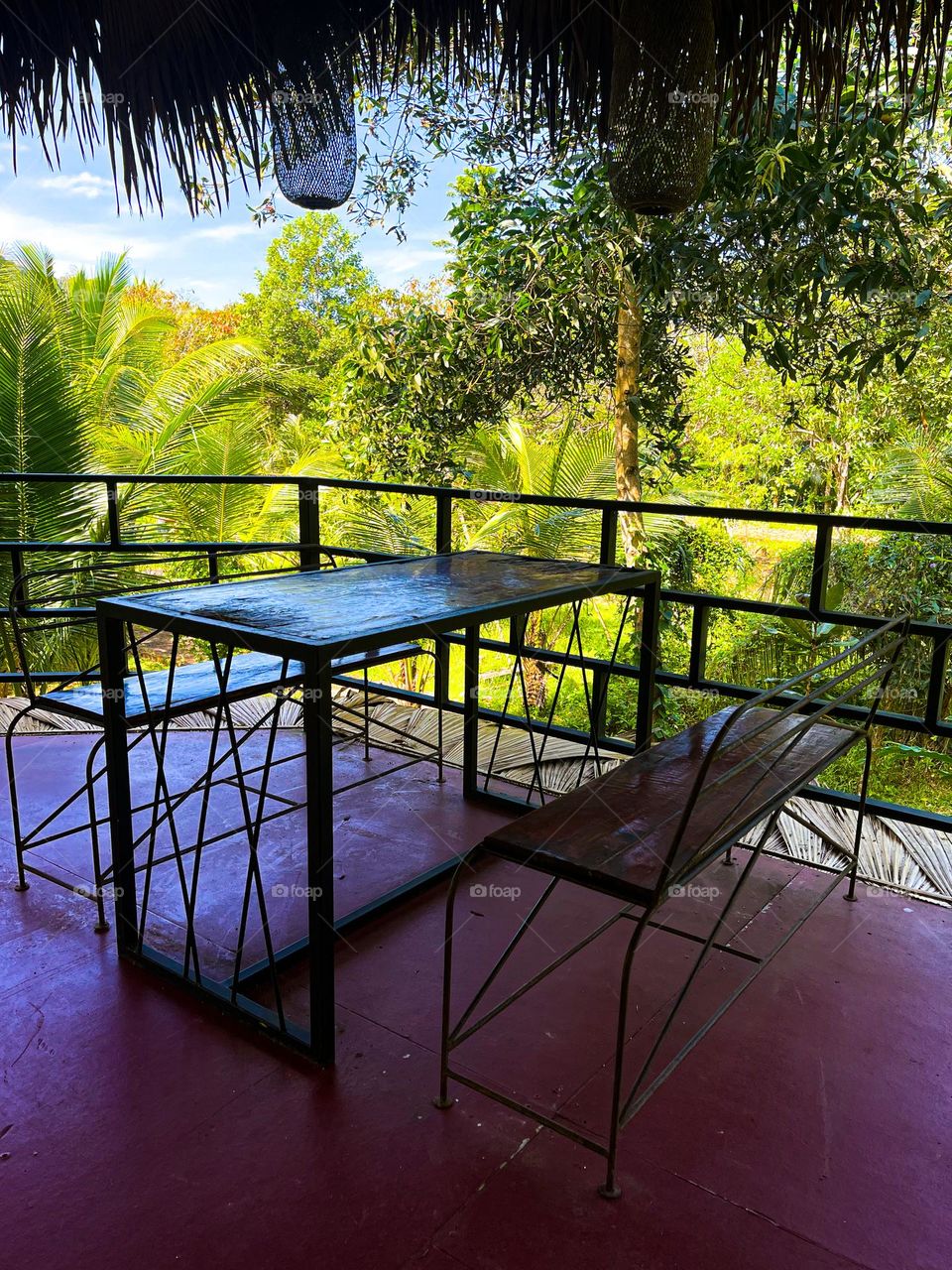 Wooden table with metal legs with benches from the same design and materials 