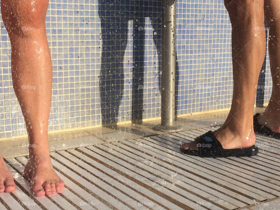 An open air shower in the morning sun after a swim in the sea. Ayia Napa, Cyprus