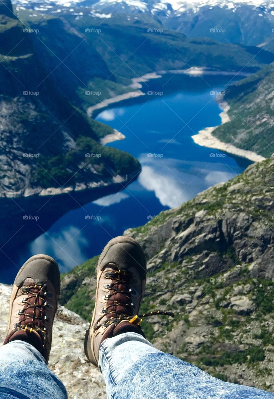 Hiking boots above the river 