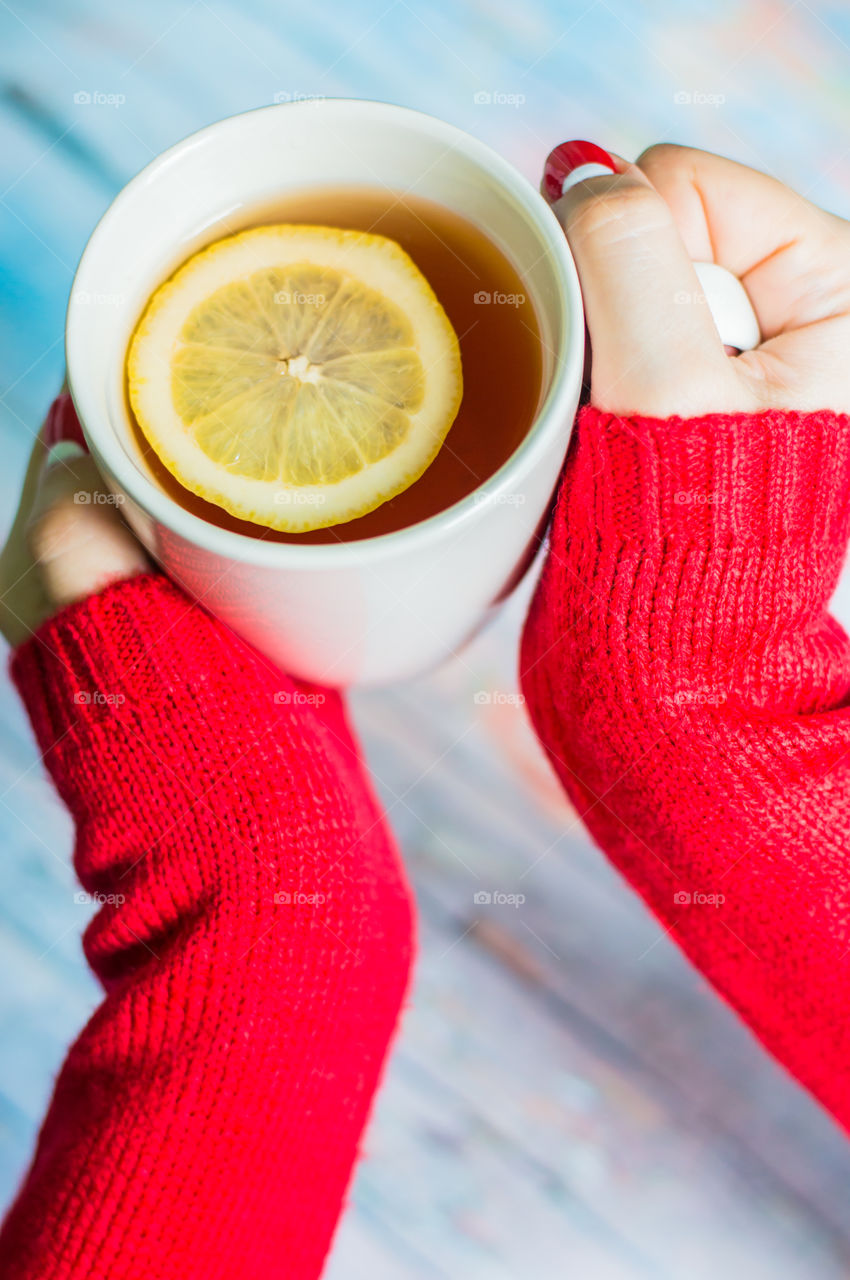 woman hand with cup of tea