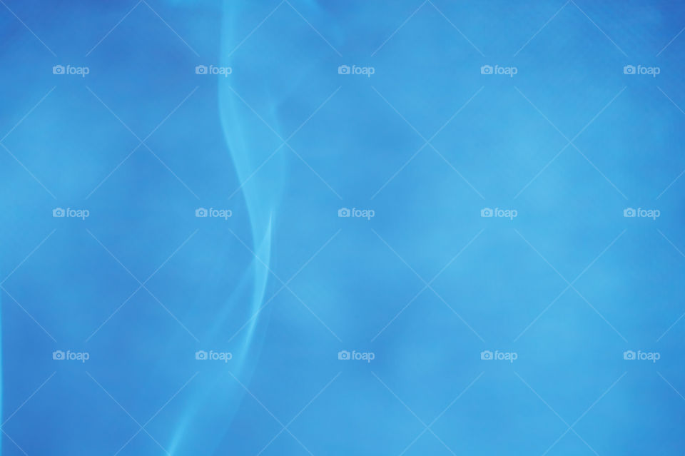 Smoke scented candles on a black background